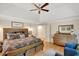 Serene primary bedroom featuring tray ceilings, hardwood floors, and modern furnishings at 2715 Woods Ridge Dr, Alpharetta, GA 30022