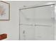 Modern shower with white subway tile and sleek glass doors at 2715 Woods Ridge Dr, Alpharetta, GA 30022