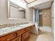 Well-lit bathroom with a granite countertop vanity at 3267 Rememberance Trce, Lawrenceville, GA 30044