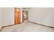 Empty bedroom showcasing a closet and doorway to the upstairs landing at 3267 Rememberance Trce, Lawrenceville, GA 30044
