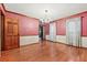 Formal dining room featuring hardwood floors, classic chandelier, and wainscoting details at 3267 Rememberance Trce, Lawrenceville, GA 30044