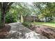 Two-story brick home with a long driveway and mature trees at 3267 Rememberance Trce, Lawrenceville, GA 30044