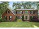 Charming two-story brick home featuring classic black shutters and a well-maintained lawn at 3267 Rememberance Trce, Lawrenceville, GA 30044