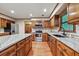 Beautiful kitchen featuring granite countertops, stainless steel appliances, island and hardwood floors at 3267 Rememberance Trce, Lawrenceville, GA 30044