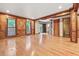 Spacious living room featuring hardwood floors, wood trim and bright windows at 3267 Rememberance Trce, Lawrenceville, GA 30044