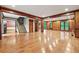 Expansive living room showcasing hardwood floors, a staircase and multiple entryways at 3267 Rememberance Trce, Lawrenceville, GA 30044