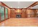 Cozy living room with custom built-ins flanking a classic fireplace at 3267 Rememberance Trce, Lawrenceville, GA 30044