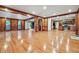 Bright living room with hardwood floors leading into kitchen area at 3267 Rememberance Trce, Lawrenceville, GA 30044