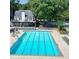 Enjoy the community pool on a hot day at this neighborhood two-story home with ample seating and shade at 3267 Rememberance Trce, Lawrenceville, GA 30044