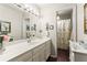 Bathroom featuring a double sink vanity and a shower with yellow floral curtains at 4040 Summit Dr, Marietta, GA 30068