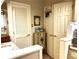 Well-lit bathroom featuring white cabinets, granite countertops, and ample storage space at 4040 Summit Dr, Marietta, GA 30068