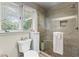Updated bathroom with a glass enclosed shower and modern fixtures at 4040 Summit Dr, Marietta, GA 30068