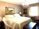 Bedroom featuring a chandelier and a large bed at 4040 Summit Dr, Marietta, GA 30068