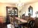 Formal dining room showcasing a chandelier, wood floors, and a large china cabinet at 4040 Summit Dr, Marietta, GA 30068