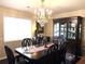Well lit dining room featuring a dark wood china cabinet and dining table at 4040 Summit Dr, Marietta, GA 30068