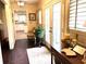Elegant foyer with decorative rug, chandelier, dark wood floors, and view of the kitchen at 4040 Summit Dr, Marietta, GA 30068