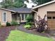 Front exterior with a curved sidewalk, landscaped yard and covered front entrance at 4040 Summit Dr, Marietta, GA 30068