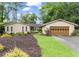 Charming single-story home with well-maintained lawn and an attached two-car garage at 4040 Summit Dr, Marietta, GA 30068