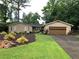 Charming single-story home boasts lush landscaping, healthy lawn and an attached garage at 4040 Summit Dr, Marietta, GA 30068