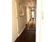 Hallway with dark wood floors and neutral walls at 4040 Summit Dr, Marietta, GA 30068