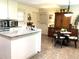 Bright kitchen with white cabinets, granite countertops, and a cozy dining area at 4040 Summit Dr, Marietta, GA 30068