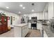 Well-lit kitchen with an island, stainless steel appliances, and white cabinets at 4040 Summit Dr, Marietta, GA 30068