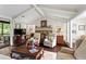 Comfortable living room with a stone fireplace and access to an outdoor deck at 4040 Summit Dr, Marietta, GA 30068