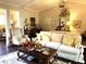 Spacious living room offers lots of seating, neutral colors and wood floors at 4040 Summit Dr, Marietta, GA 30068