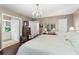 Spacious main bedroom with a connecting bathroom and view into additional bedroom space at 4040 Summit Dr, Marietta, GA 30068