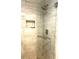 Tiled walk-in shower features a showerhead, niche and glass door, ready for a refreshing experience at 4040 Summit Dr, Marietta, GA 30068
