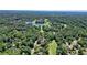 Overhead shot of the surrounding neighborhood and golf course showcasing the community's scenic location at 10310 Amberside Ct, Roswell, GA 30076