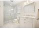 Elegant bathroom with glass shower, white marble vanity, and modern fixtures at 10310 Amberside Ct, Roswell, GA 30076