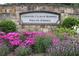 The Country Club of Roswell entrance sign beautifully landscaped with colorful flowers at 10310 Amberside Ct, Roswell, GA 30076