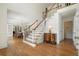 Grand foyer features hardwood floors, elegant staircase, and bright, open space for a welcoming entrance at 10310 Amberside Ct, Roswell, GA 30076