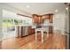 Bright eat-in kitchen features stainless appliances, white marble table, and wood cabinets at 10310 Amberside Ct, Roswell, GA 30076