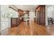 Spacious kitchen with stainless steel appliances, wood cabinetry, and hardwood flooring at 10310 Amberside Ct, Roswell, GA 30076