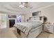 Spacious main bedroom with a tray ceiling, walk-in closet, and an en-suite bathroom at 1411 Primrose Park Rd, Sugar Hill, GA 30518