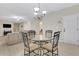 Open floor plan with kitchen dining area leading to the living room at 1411 Primrose Park Rd, Sugar Hill, GA 30518