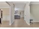 Bright foyer with sleek flooring leads to a spacious living area with a fireplace at 1411 Primrose Park Rd, Sugar Hill, GA 30518