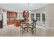 Eat-in kitchen features wood cabinets, granite counters, and stainless steel appliances at 1411 Primrose Park Rd, Sugar Hill, GA 30518