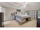Main bedroom boasts tray ceilings, storage, and natural light at 1411 Primrose Park Rd, Sugar Hill, GA 30518