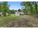 Backyard view featuring a well-sized yard and a wooden deck attached to the house at 1980 Oakdale Se Ct, Smyrna, GA 30082