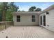 Wooden back deck overlooking the spacious backyard with exterior access to the house at 1980 Oakdale Se Ct, Smyrna, GA 30082