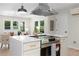 Bright kitchen features stainless appliances, island cooktop, and open design to the adjacent living area at 1980 Oakdale Se Ct, Smyrna, GA 30082