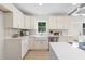 Renovated kitchen with bright white cabinets, stainless appliances, and an open design with lots of sunlight at 1980 Oakdale Se Ct, Smyrna, GA 30082