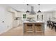 Modern kitchen with a center island and stylish seating, seamlessly integrated with the dining area at 1980 Oakdale Se Ct, Smyrna, GA 30082