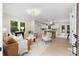 Open-concept living area connecting to the kitchen, featuring hardwood floors and ample natural light at 1980 Oakdale Se Ct, Smyrna, GA 30082