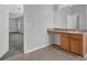 Bathroom showcasing a sink, countertop with an open doorway into a bedroom at 6032 Trotters Cir, Fairburn, GA 30213