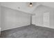 Spacious bedroom with neutral walls, vaulted ceiling, plush carpeting, and ample natural light at 6032 Trotters Cir, Fairburn, GA 30213