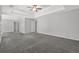 Large bedroom with tray ceilings, and open doorways for ample living space at 6032 Trotters Cir, Fairburn, GA 30213